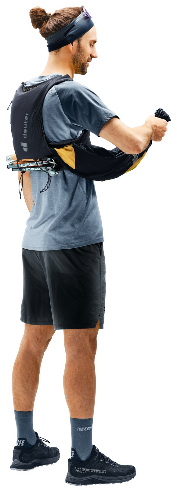 Deuter Traick 5 worn by a runner, side view, with folded poles carried across the back