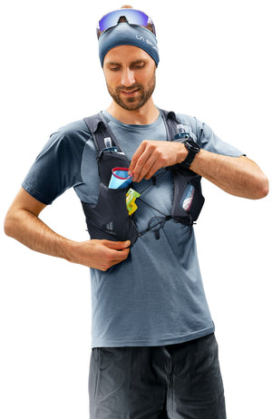 Runner reaching into a shoulder strap pocket on the Deuter Traick 9
