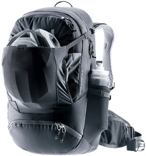 Deuter Trans Alpine 28 SL with a bike helmet in the front stash pocket and a bottle at the side