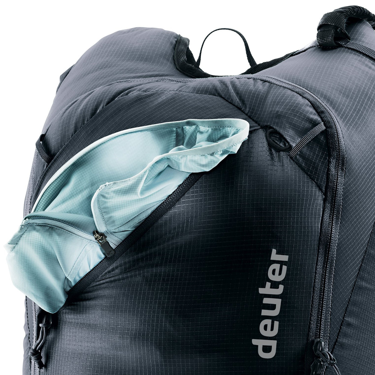 Deuter Updays 20 zipped front compartment open with a jacket inside