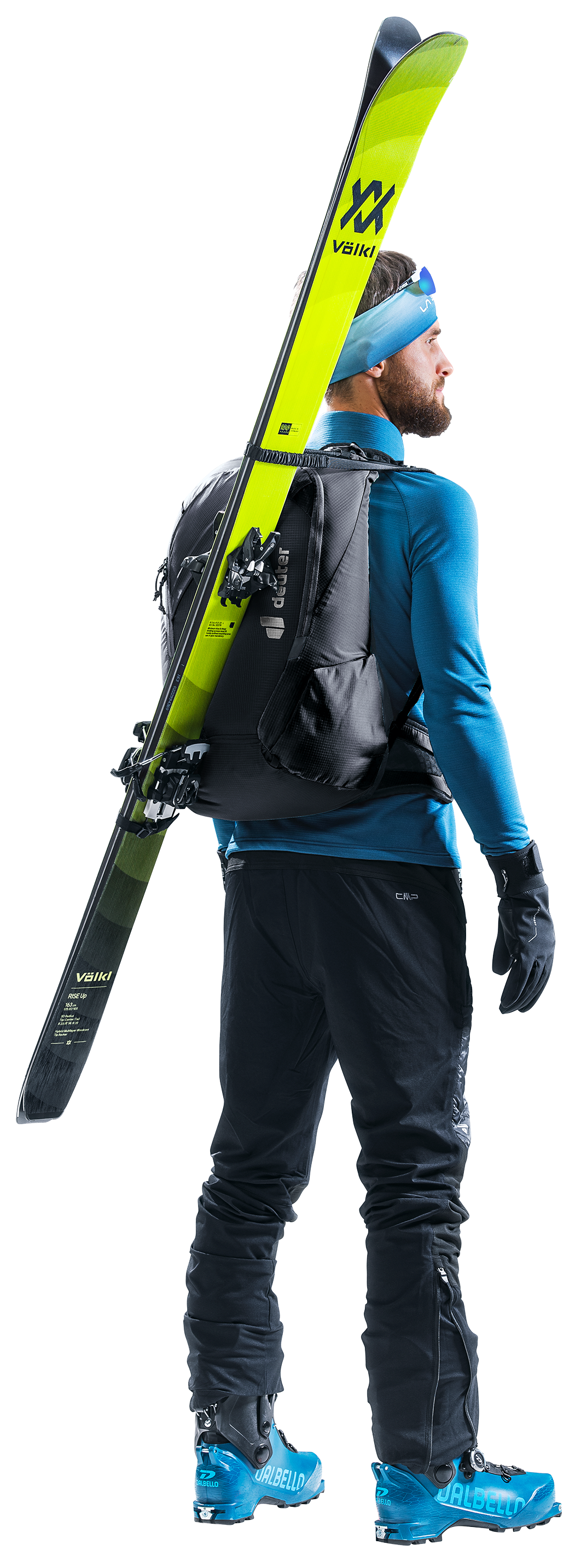 Ski tourer wearing the Deuter Updays 20 with skis carried diagonally
