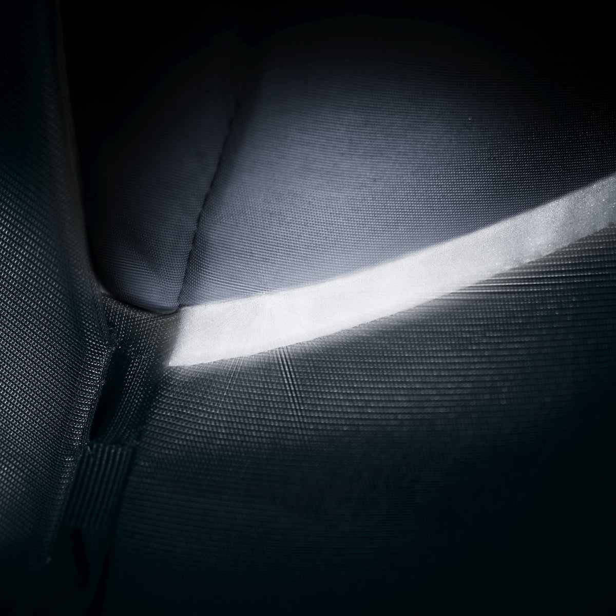 Close-up of the reflective trim on the Deuter Xberg 25 catching light